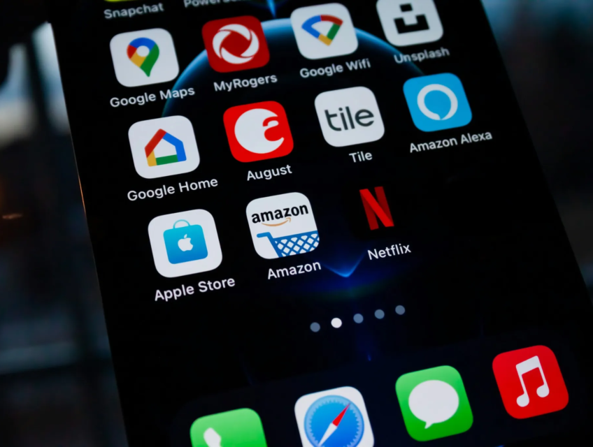 Close-up of a smartphone screen displaying popular app icons, including Amazon, Netflix, and Google services.