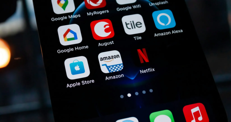 Close-up of a smartphone screen displaying popular app icons, including Amazon, Netflix, and Google services.