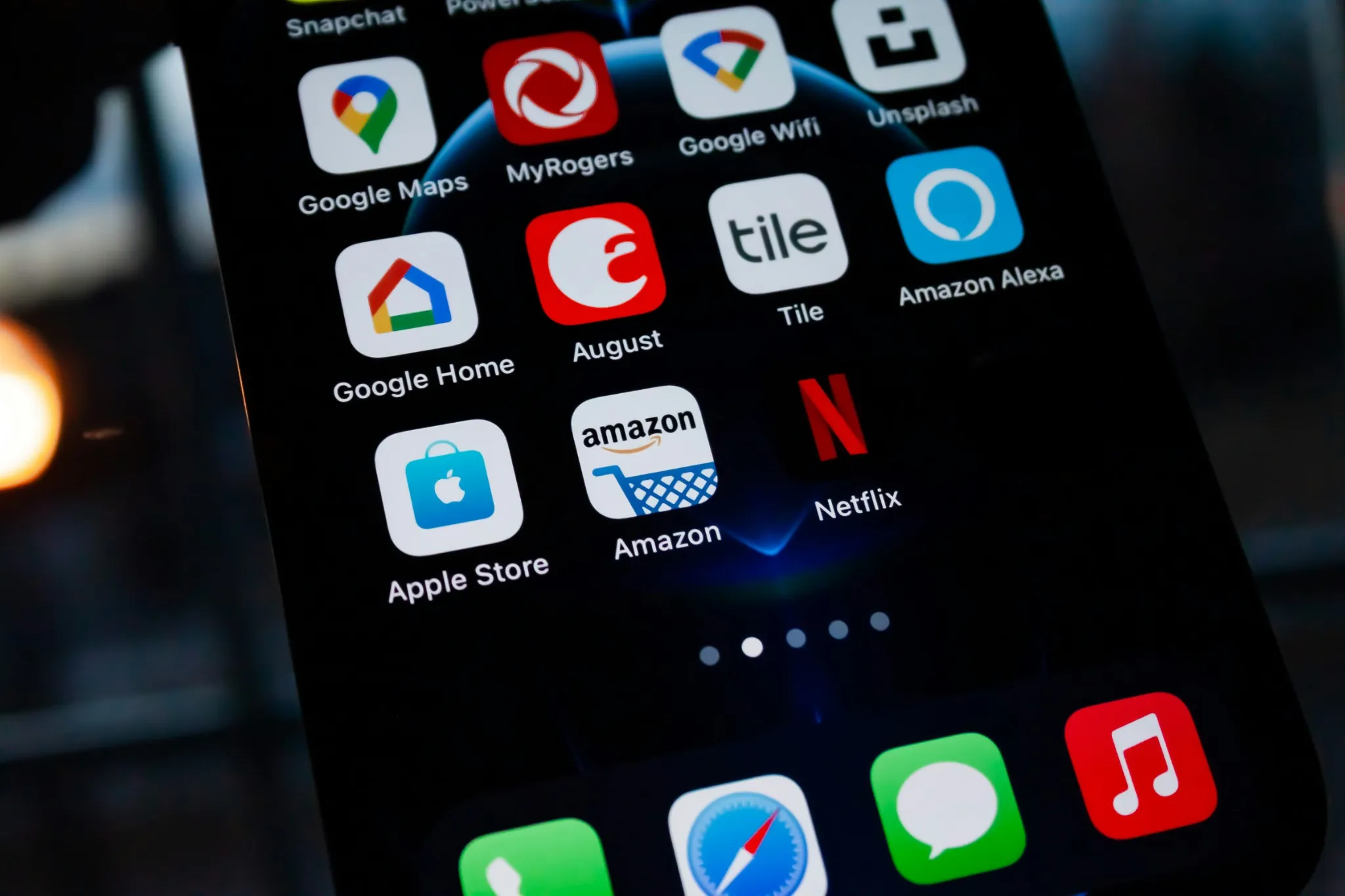 Close-up of a smartphone screen displaying popular app icons, including Amazon, Netflix, and Google services.